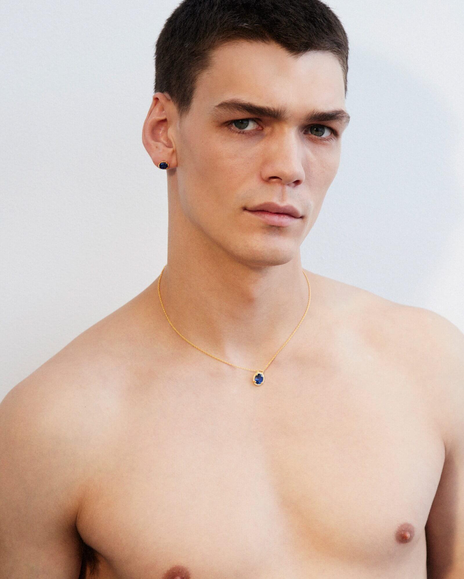 Image of a man stylishly wearing Dear Letterman's silver gemstone jewellery, showcasing the unique design and vibrant colours of the gemstone necklace.