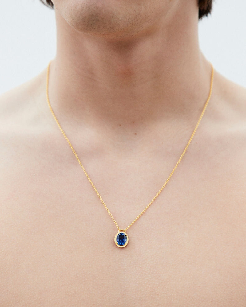 Gold necklace with store sapphire pendant